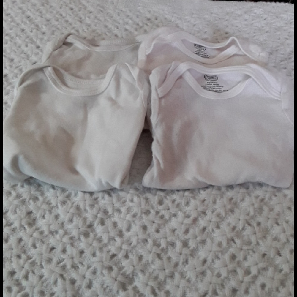 Four white onesies